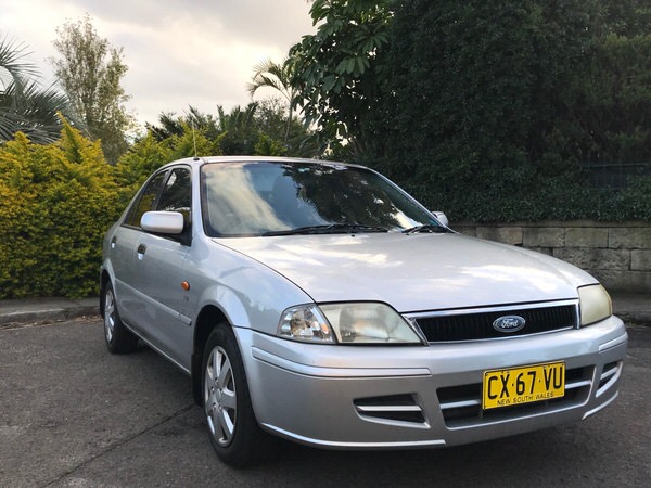 Sell my Ford Laser for cash - drivers front side angle view of a car sold to us