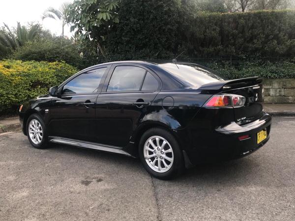 We Buy Sydney Cars WANTED Mitsubishi Lancers - passengers side view of vehicle