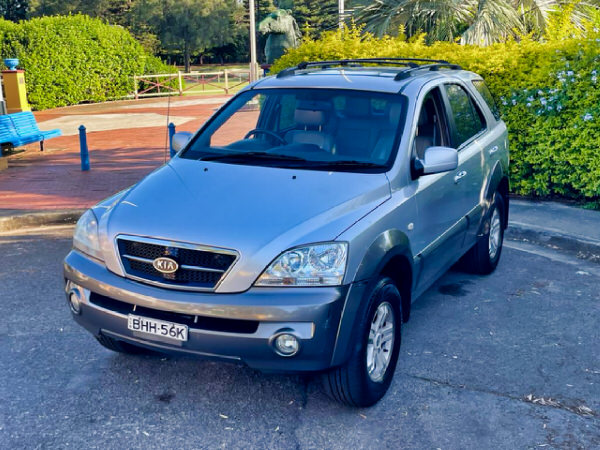 Sell my Kai Sorento for cash - front passenger side view of a vehicle we bought from a customer