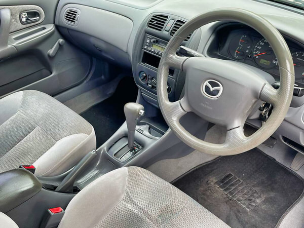 Wanted Mazda 323 for cash - view from the drivers seat photo