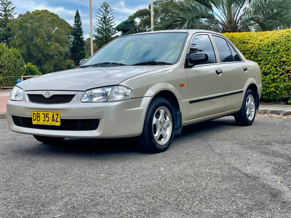 We buy all cars for cash - photo showing a used Mazda 323 purchased for cash